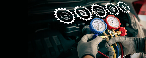 Hand of car mechanic technician use meter to check car air conditioner system heat problem and fix repairing and filling air refrigerant.