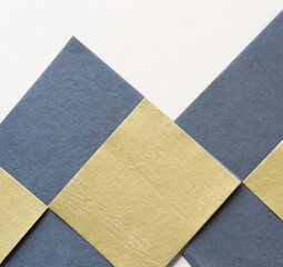 Fototapeta premium neutral yellow/green and gray paper tiles with texture on blank paper