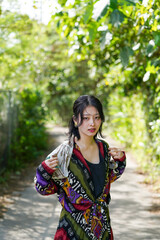 Fototapeta premium 亜熱帯の森を歩くアジア女性7