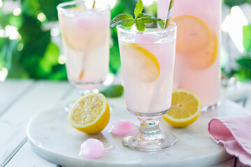 Frosty refreshing glasses of sweet lemonade, ready for drinking.