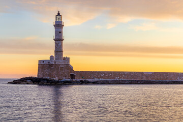 Chania lighthouse at sunrise, Old Venetian Harbour, Crete Island, Greece