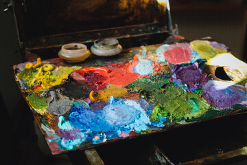 Palette and brushes for oil paints.