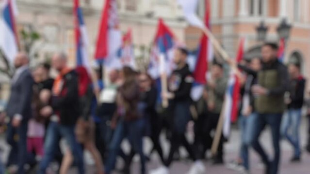 Defocused political rally of the Serbian people on main street. Demonstration, parade and protest