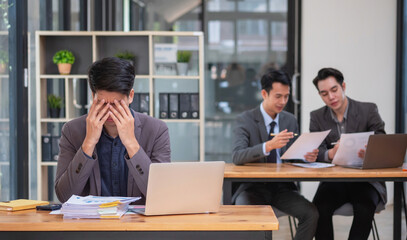 Concept Burnout Syndrome. Businessman feels uncomfortable working. Which is caused by stress, accumulated from unsuccessful work And less resting body. Consult a specialist psychiatrist.