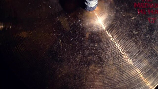 Close-up view of cymbals in drum kit and drumsticks near it, musical instrument.