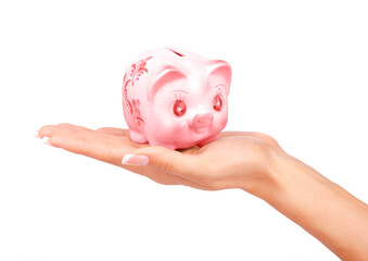 Woman's hand dropping a coin piggy bank