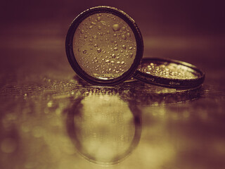 lens filters with water droplets reflected in the mirror