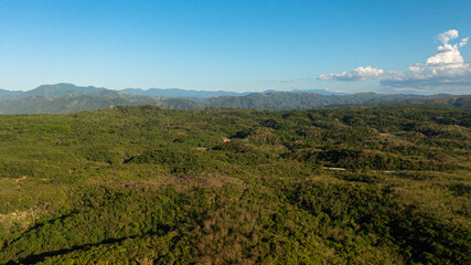 Mountain slopes covered with rainforest and jungle View from above. Philippines.