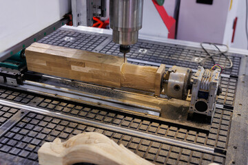 Wood carving machine. Modern automatic woodworking machine with CNC. Furniture production.