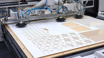 Laser cutting of wood, plywood with CNC. Modern machine industrial technology.