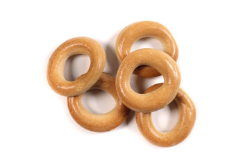Fototapeta premium Dry bagels isolated on white, flat lay