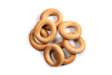 Dry bagels isolated on white, flat lay