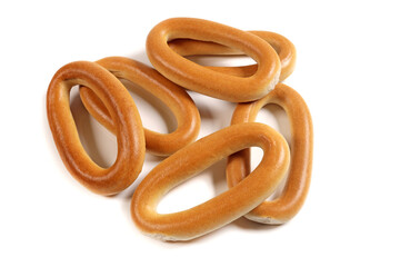 Dry bagels isolated on white, flat lay