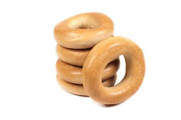 Stack of dry bagels isolated on white