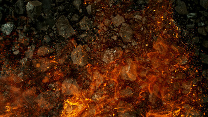 Burning coal with fire, top view shot.