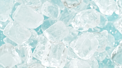 Freeze motion of flying ice cubes isolated on blue background.