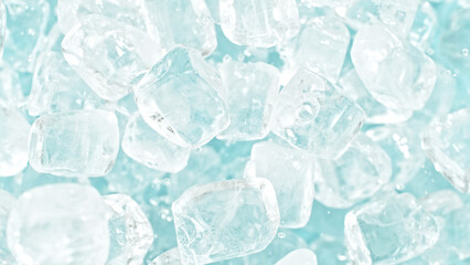 Freeze motion of flying ice cubes isolated on blue background.