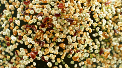 Rotating Raw Various Legumes on Black Background.