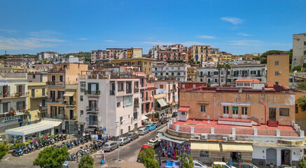 Aerial view of Pozzuoli port from a drone in summer season, Italy - obrazy, fototapety, plakaty
