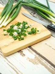 top view of green onion cut on a cutting board