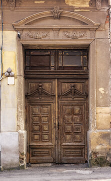 vintage door on the ancient facade. typical european architectural element