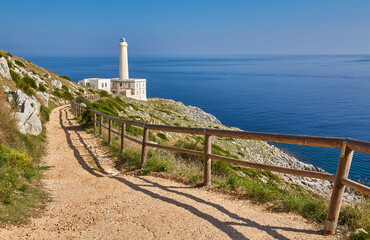 Fototapeta na wymiar lighthouse of Cape of Otranto in Apulia standing on hard granite rocks is the most easterly point of Italy, marks the meeting of the Ionian Sea and the Adriatic Sea.