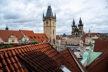 Obraz premium Panorama of Prague city with medieval , old architecture, Cathedrals, gothic towers and spires. landscape of Praga, view on the town with red roofs on houses and top landmarks. 