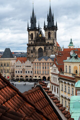 Fototapeta premium Panoramic view over the cityscape of Prague roofs at dramatic sunset, Czech Republic 