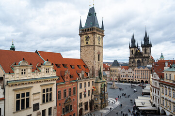 Fototapeta premium Panoramic view over the cityscape of Prague roofs at dramatic sunset, Czech Republic 