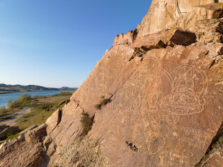 Petroglyphs of Tamgaly Tas – fine art of stone carving and fine contour lines dated to the second half of the 17th century. Left Bank of the river Or.