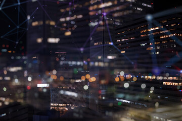 Fototapeta na wymiar Night view of a skyscraper with internet network effect