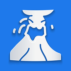 Paper cut Volcano eruption with lava icon isolated on blue background. Paper art style. Vector