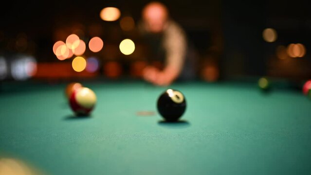 Man breaks spheres in billiard