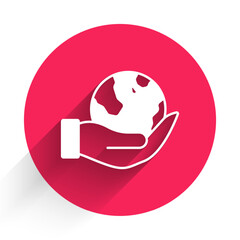 White Human hand holding Earth globe icon isolated with long shadow background. Save earth concept. Red circle button. Vector