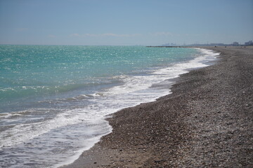 waves on mediterranean sea with pebble beach