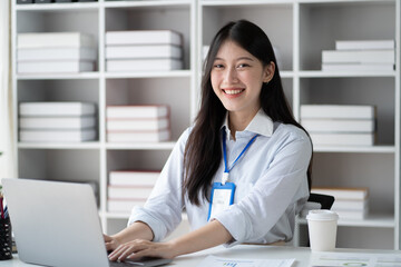 Portrait of young beautiful businesswoman working in the office room.
