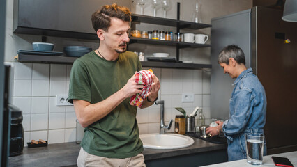 Caucasian Man and Mother senior woman Bonding in the Kitchen talk