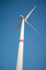 Windmill against a clear white sky