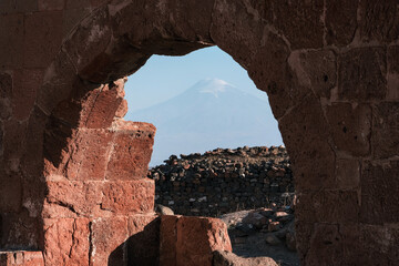 View of Mount Ararat through the gate of medieval Dashtadem Fortress on sunny summer day. Dashtadem, Aragatsotn Province, Armenia.