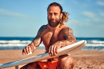 Couple of surfers on the beach