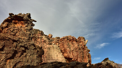 Red sandstone rock sculptures against a blue sky with clouds in the Cederberg in the Western Cape of South Africa