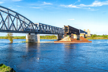 Old ruined railway bridge. Railroad transportation in Europe