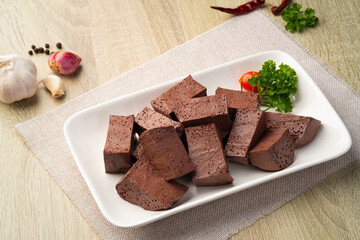 Sliced Chicken blood curd in white plate also known as 