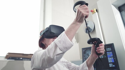 A real doctor performs an MRI scan for a patient at the clinic. Uses virtual reality technology in...