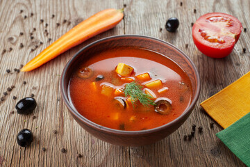 Vegan soup with tofu. tomato and olives
