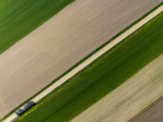 Brown fields green meadows in Poland, agriculture drone aerial photography, nature landscape, pattern natural background
