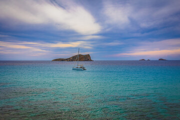 Obraz premium Beautiful sandy Cala Comte beach with azure blue sea water, Ibiza island, Spain