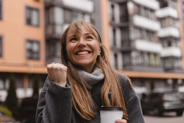 Beautiful young woman happy and excited expressing winning gesture. Successful and celebrating...