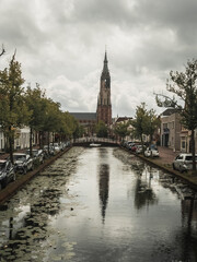 Fototapeta na wymiar Delft (The Netherlands).The New Church through the channel