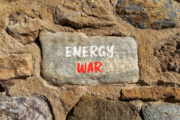 Energy war symbol. Concept words Energy war on beautiful big grey stone. Beautiful stone wall background. Business and Energy war concept. Copy space.